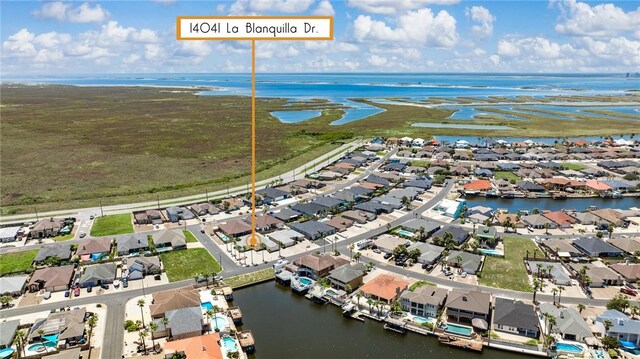 aerial view of residential area with a nearby body of water
