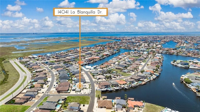 aerial view of residential area with a nearby body of water
