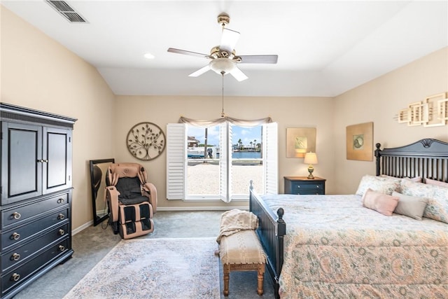 bedroom featuring carpet, vaulted ceiling, baseboards, and ceiling fan