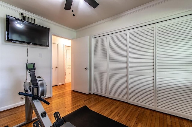 419 Peerman Pl, Corpus Christi, TX 78411 - exercise room with crown molding, hardwood / wood-style flooring, a ceiling fan, and baseboards