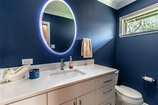 419 Peerman Pl, Corpus Christi, TX 78411 - bathroom featuring vanity, toilet, and ornamental molding