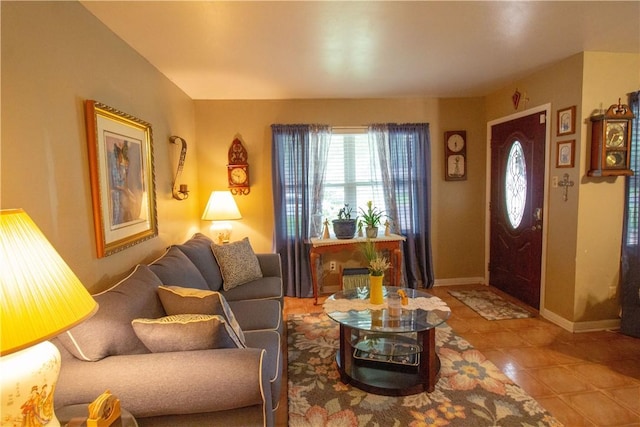905 E Randall St, Beeville, TX 78102 - living room with tile patterned floors and baseboards