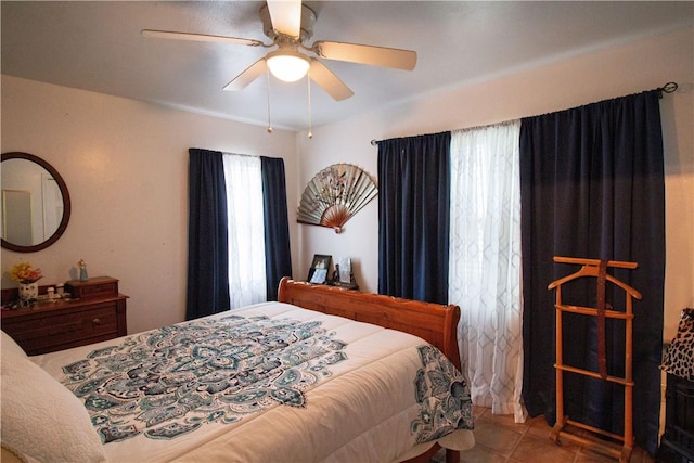 905 E Randall St, Beeville, TX 78102 - tiled bedroom featuring a ceiling fan