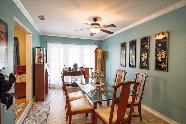 905 E Randall St, Beeville, TX 78102 - dining area with visible vents, ornamental molding, baseboards, and ceiling fan