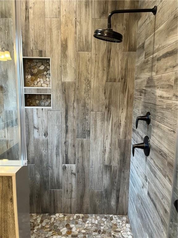 full bathroom with tiled shower