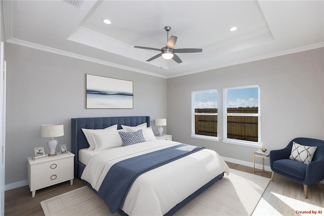 6214 Sadie St, Corpus Christi, TX 78415 - bedroom featuring a tray ceiling, wood finished floors, recessed lighting, a ceiling fan, and crown molding