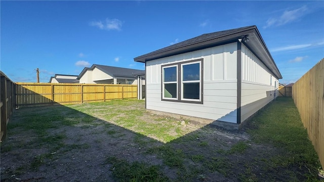 6214 Sadie St, Corpus Christi, TX 78415 - rear view of house with a fenced backyard and board and batten siding