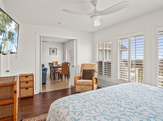 bedroom with dark wood-type flooring and ceiling fan