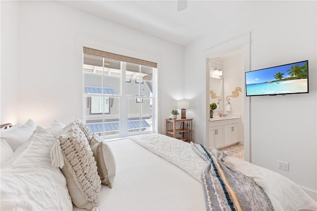 bedroom with ceiling fan and ensuite bathroom