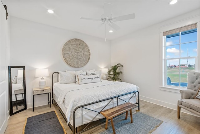 bedroom with recessed lighting, baseboards, light wood-style floors, and ceiling fan