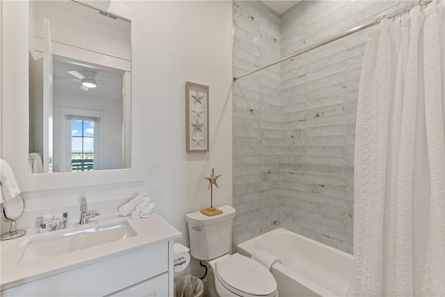 full bathroom featuring shower / bathtub combination with curtain, toilet, and vanity