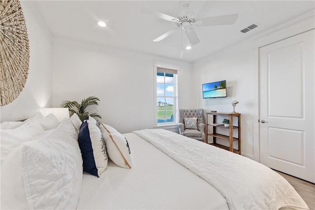 bedroom featuring recessed lighting, visible vents, wood finished floors, and ceiling fan