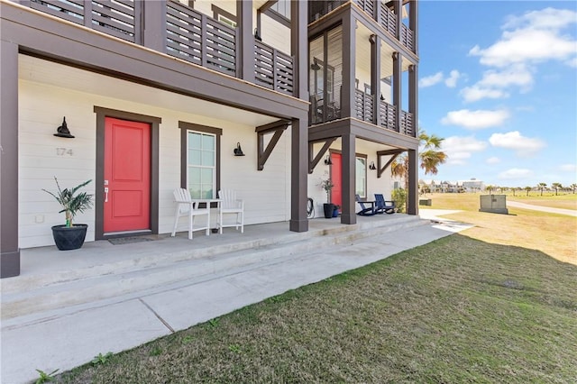 doorway to property with a yard