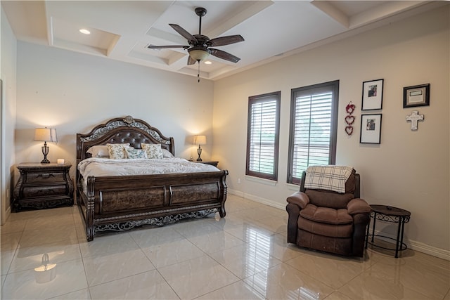 tiled bedroom with coffered ceiling and ceiling fan