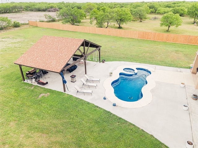 view of swimming pool featuring a lawn and a patio area