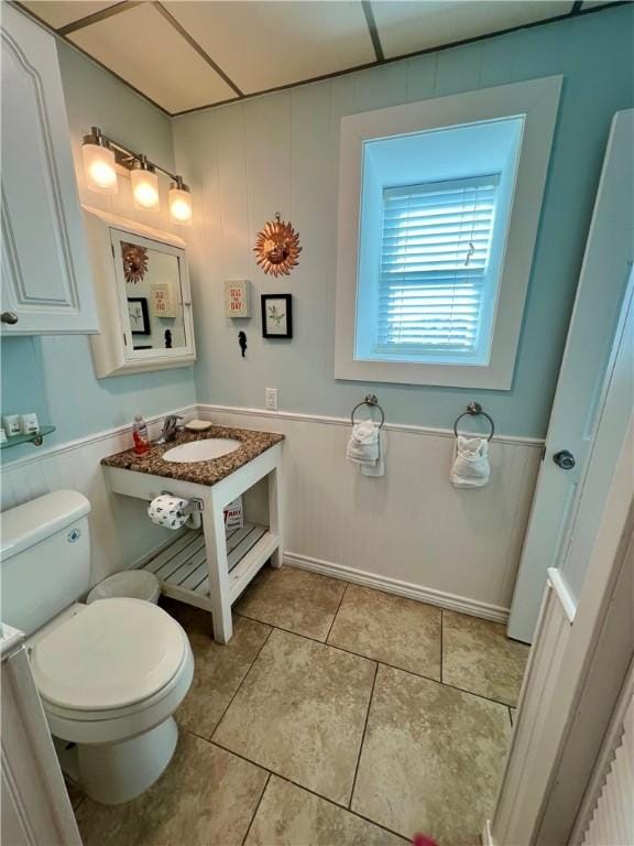 bathroom featuring sink and toilet