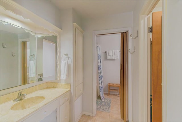 122 Palm Dr, Rockport, TX 78382 - full bathroom featuring tile patterned floors, curtained shower, vanity, and baseboards