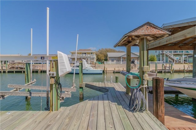 122 Palm Dr, Rockport, TX 78382 - dock area featuring boat lift and a water view