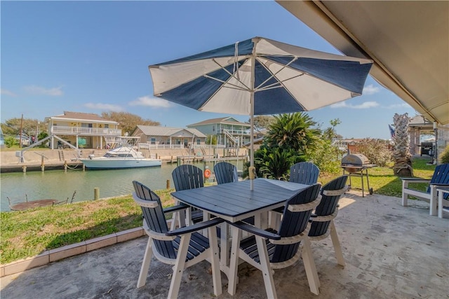 122 Palm Dr, Rockport, TX 78382 - view of patio / terrace featuring outdoor dining area and a water view
