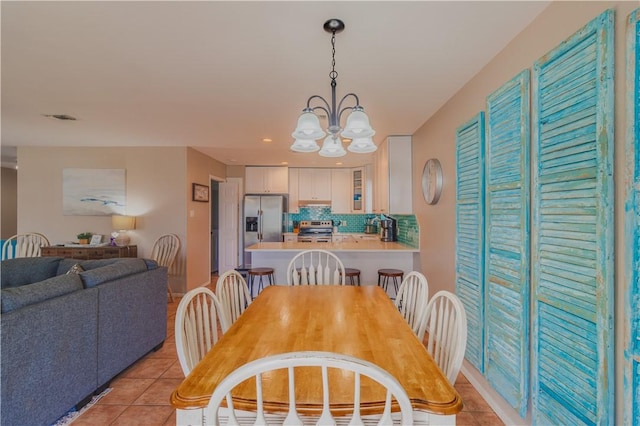 122 Palm Dr, Rockport, TX 78382 - dining area with recessed lighting, visible vents, a notable chandelier, and light tile patterned flooring