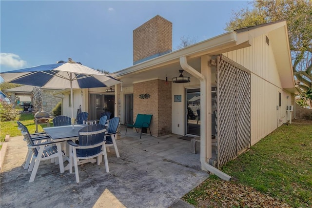 122 Palm Dr, Rockport, TX 78382 - view of patio / terrace with outdoor dining area