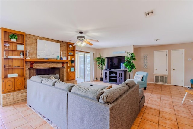 122 Palm Dr, Rockport, TX 78382 - living area featuring light tile patterned floors, visible vents, and ceiling fan