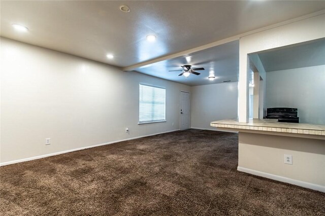 5921 Riley Dr, Corpus Christi, TX 78412 - unfurnished living room featuring dark carpet, ceiling fan, and recessed lighting