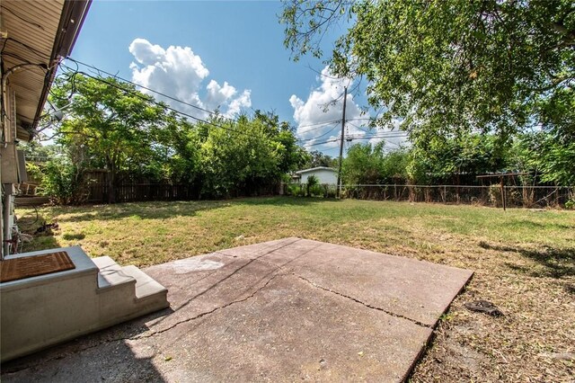5921 Riley Dr, Corpus Christi, TX 78412 - fenced backyard with a patio area