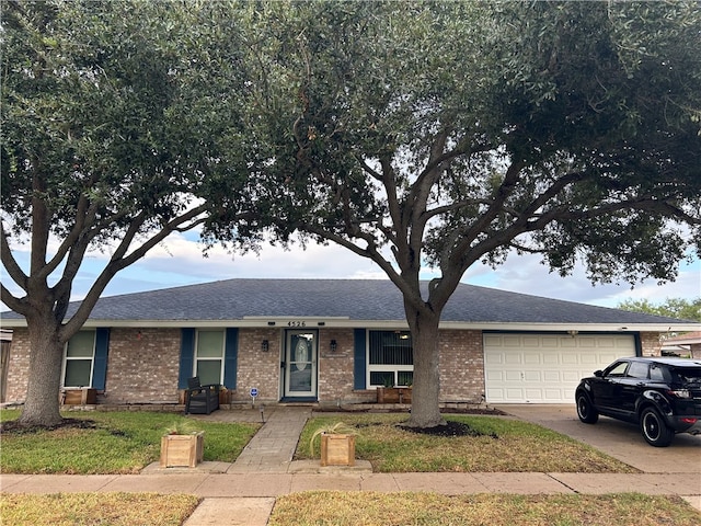 single story home featuring a garage