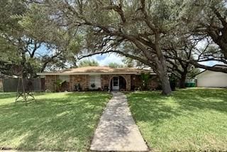 1638 W Palm Dr, Aransas Pass, TX 78336 - ranch-style home with a front yard