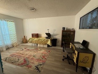 1638 W Palm Dr, Aransas Pass, TX 78336 - office featuring wood finished floors and a textured ceiling