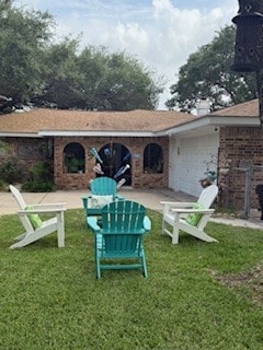 1638 W Palm Dr, Aransas Pass, TX 78336 - back of house with a lawn, a chimney, and brick siding