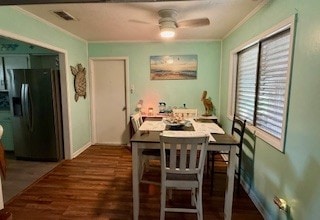 1638 W Palm Dr, Aransas Pass, TX 78336 - dining space featuring crown molding, ceiling fan, and wood finished floors