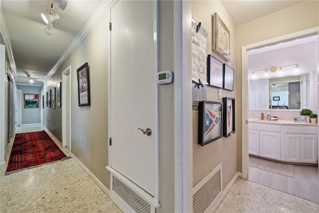 hall featuring ornamental molding