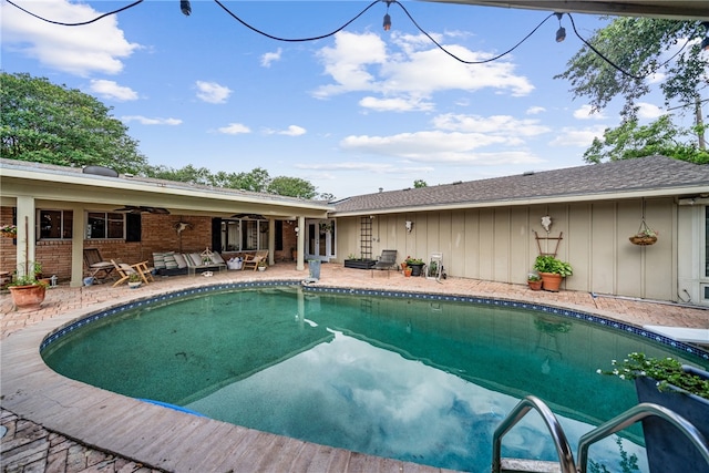 view of pool featuring ceiling fan and a patio