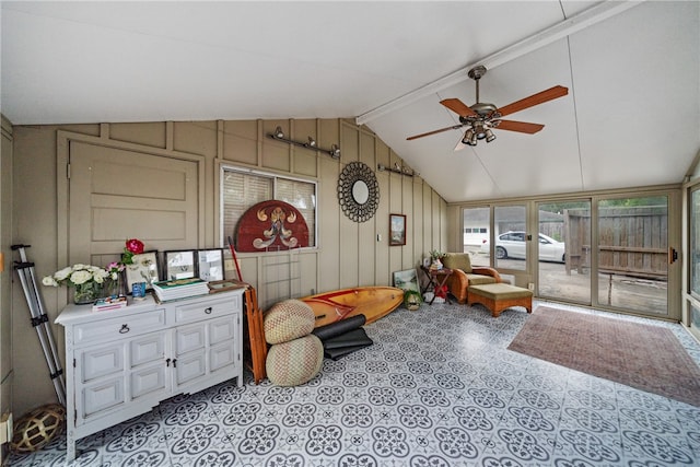 interior space with ceiling fan and vaulted ceiling