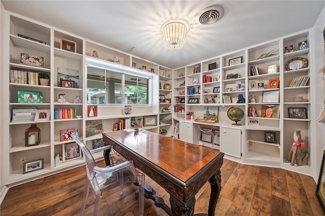 home office with an inviting chandelier and hardwood / wood-style flooring