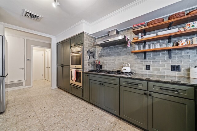 kitchen with dark stone counters, wall chimney exhaust hood, tasteful backsplash, crown molding, and appliances with stainless steel finishes