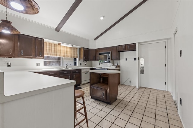 kitchen with kitchen peninsula, a breakfast bar area, white dishwasher, and sink