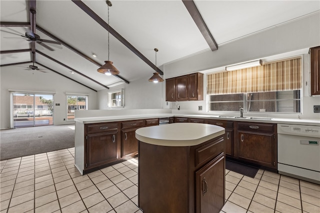 kitchen with sink, beam ceiling, a kitchen island, pendant lighting, and dishwasher