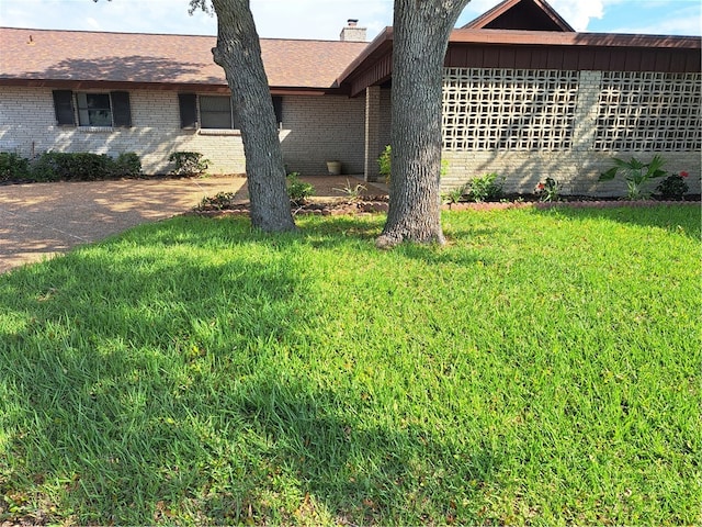 view of home's exterior featuring a lawn