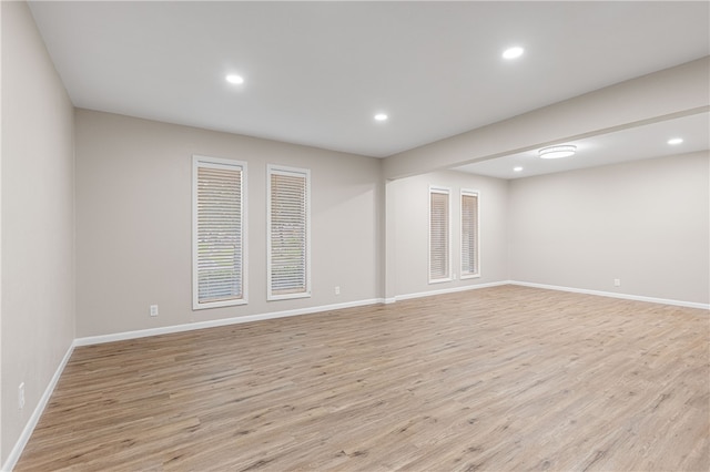 spare room featuring light hardwood / wood-style floors