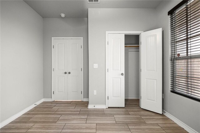1012 Santa Catalina St, Portland, TX 78374 - unfurnished bedroom with a closet, wood tiled floors, and baseboards