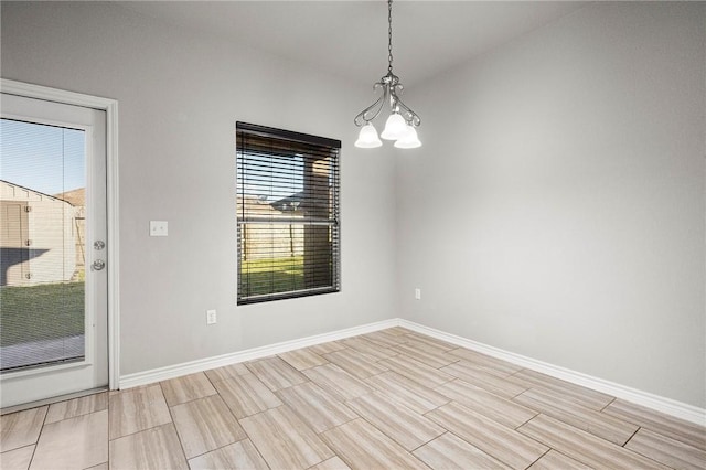 1012 Santa Catalina St, Portland, TX 78374 - empty room featuring baseboards, healthy amount of natural light, a chandelier, and wood finish floors