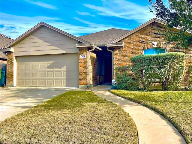 ranch-style house featuring a garage, a front yard, and brick siding