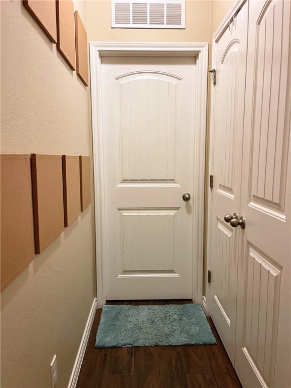 doorway to outside featuring dark hardwood / wood-style flooring