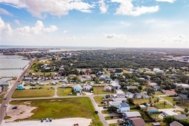 aerial perspective of suburban area with a nearby body of water