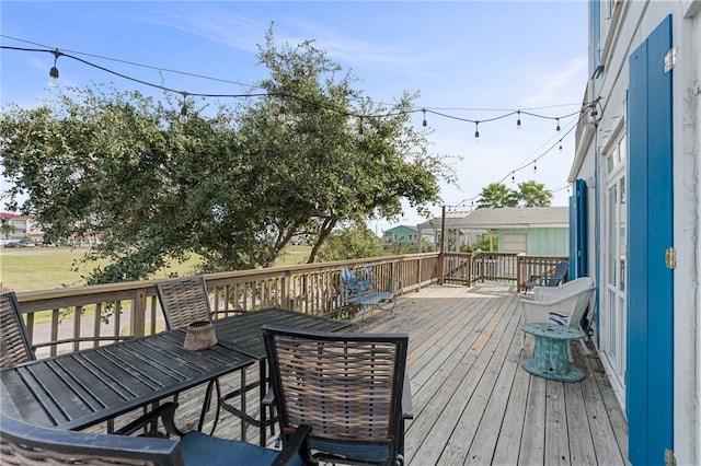 wooden deck with outdoor dining area