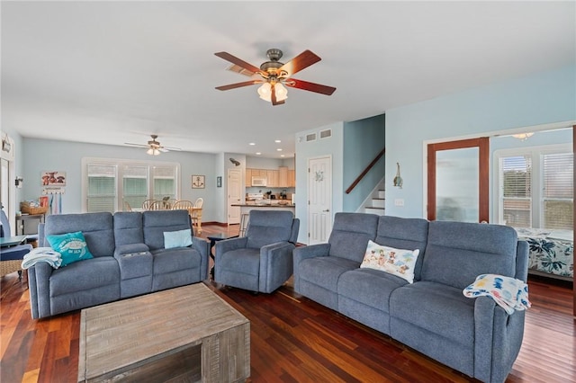 living room with a ceiling fan, stairway, healthy amount of natural light, dark wood-style floors, and recessed lighting