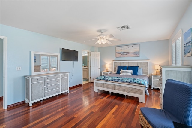 bedroom with dark hardwood / wood-style flooring, ceiling fan, and ensuite bath